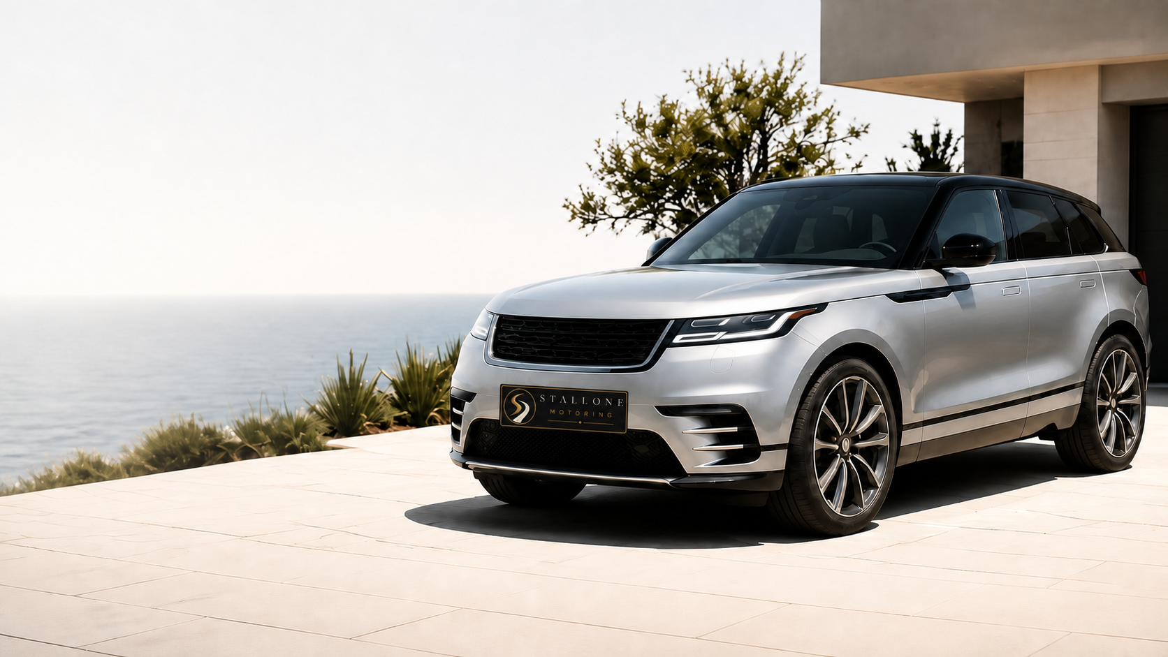 Metallic silver luxury SUV in a refined Southern California coastal setting