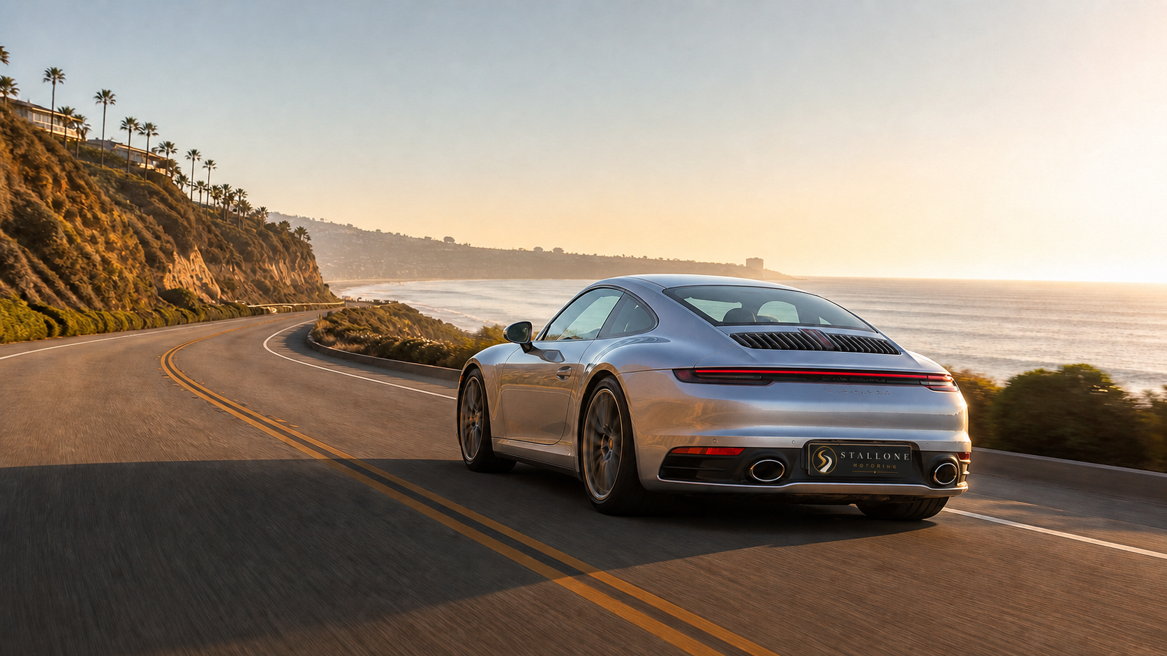 Silver Porsche on a California coastal road
